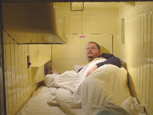 The author at a capsule hotel - cheapest way to stay in Tokyo