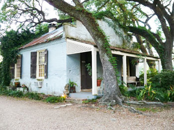 In the 1800s, when most of St. Francisville's plantations were built, kitchens were deemed too dangerous to house inside the main home. This old kitchen is still standing on the grounds of the Butler Greenwood Plantation. Today it is a B&B cottage. Photo by Henry Cancienne.