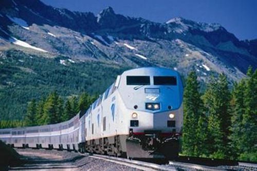 An Amtrak locomotive cruises through the American west.