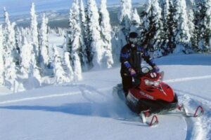 Sober travel: Snowmobiling in Big Sky, Montana. Absolute Travel photos.