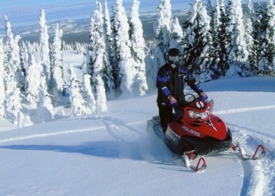 Sober travel: Snowmobiling in Big Sky, Montana. Absolute Travel photos.