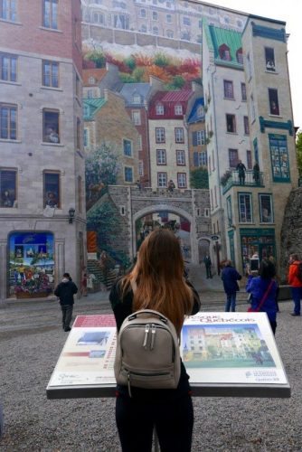 Admiring a large mural in downtown Quebec City.
