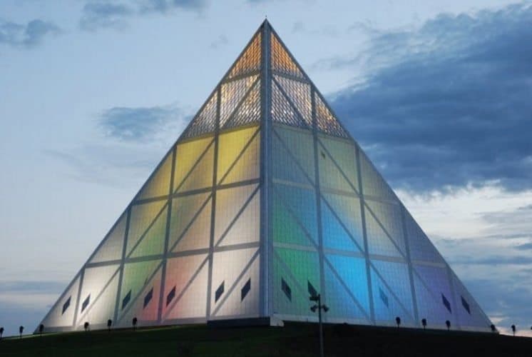 The pyramid's triangles are made out of granite, and a glazed apex which can be seen on top.