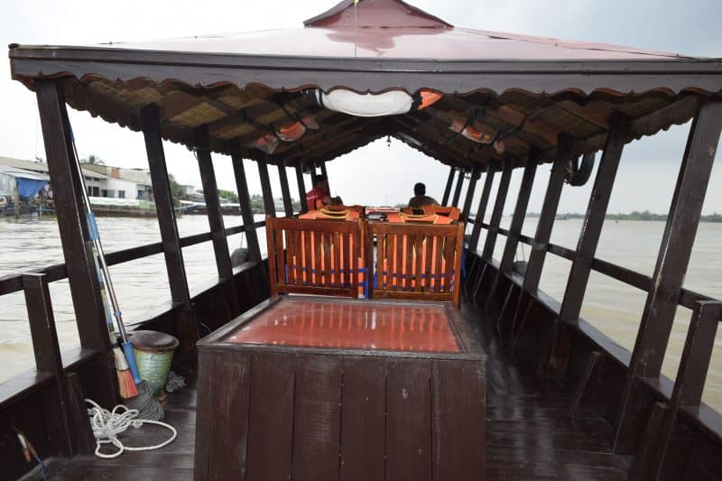 A longboat cruising down the Mekong River.