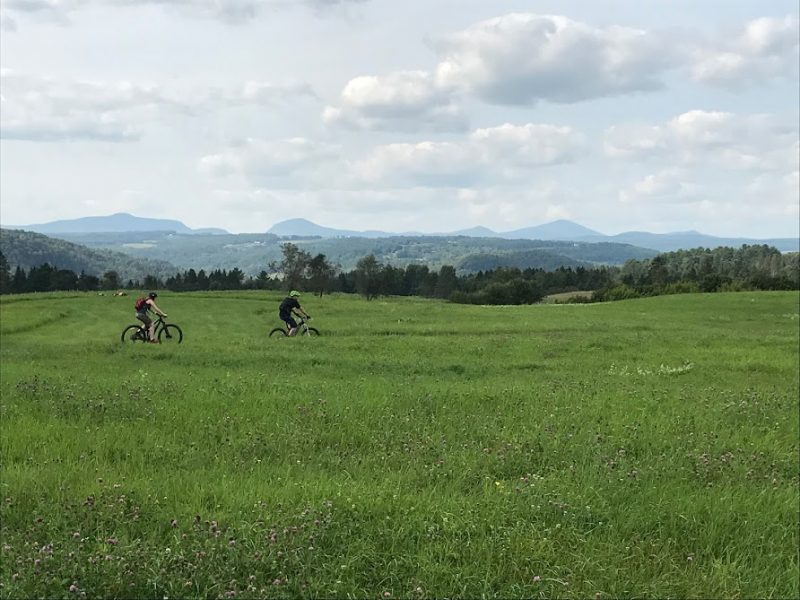 Some mountain bikers enjoying the scenery of Kingdom Trails.