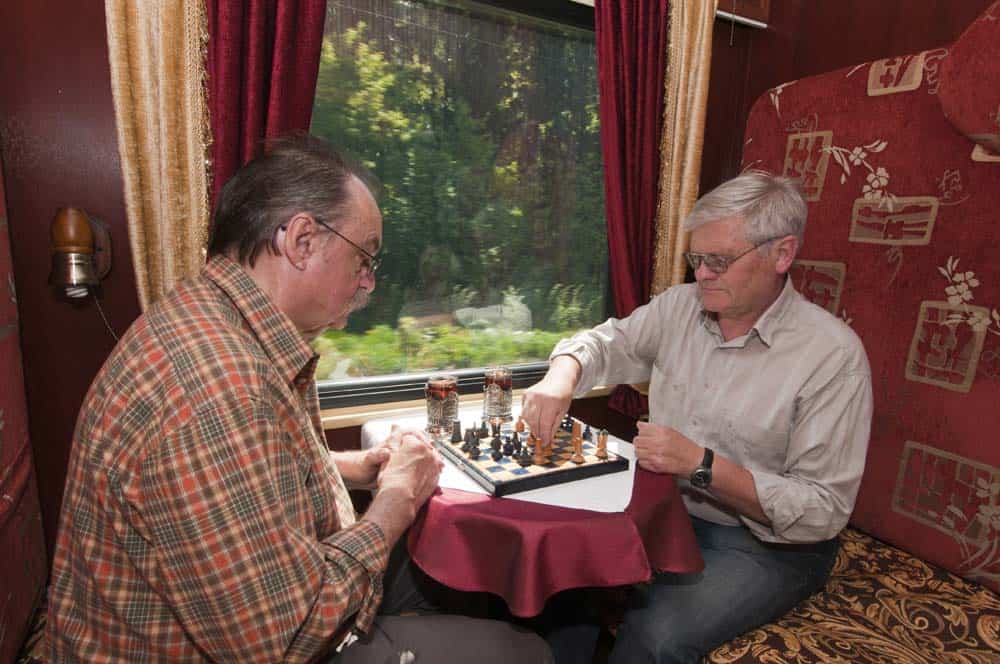 Two men playing chess as they ride the train to their next destination. Pictures from Great Dane Journeys website.