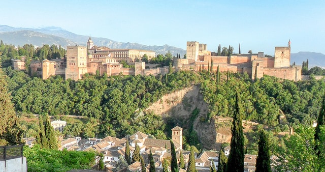 The Alhambra from the Mirador San Nicolas, Granada, Spain. This is one of the seven college towns that are great places to retire on the cheap.