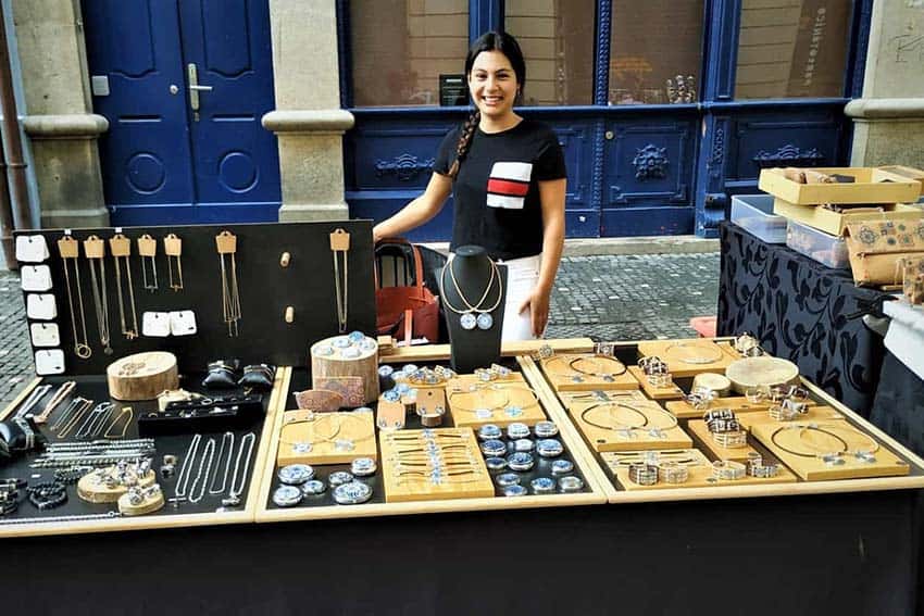 Street vendor at Sunday flea market, Porto, Portugal