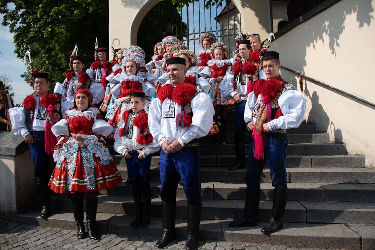 The participants in The Ride of the Kings gather after the mandatory church service for photos. The young boy chosen as the king stands in the middle, flanked by his parents.