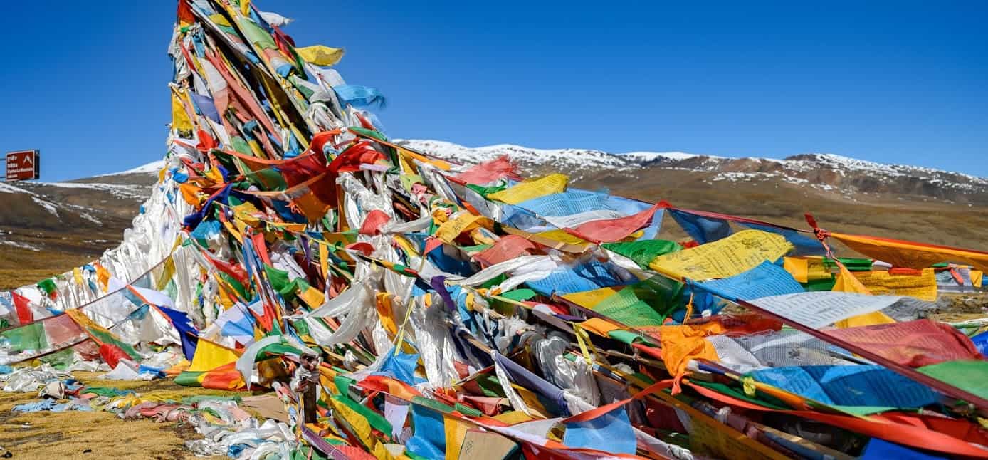 The Friendship Highway crosses over three mountain passes, all of which are marked with thousands of prayer flags left by travelers seeking a blessing from the Gods.