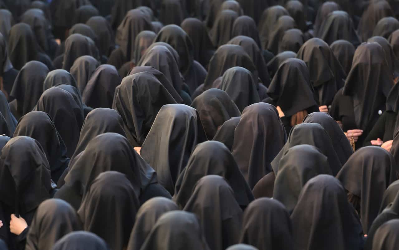 Women dressed all in black commemorate Mary's suffering during the Processione della Desolata in Canosa. Photo courtesy of VAWAA.