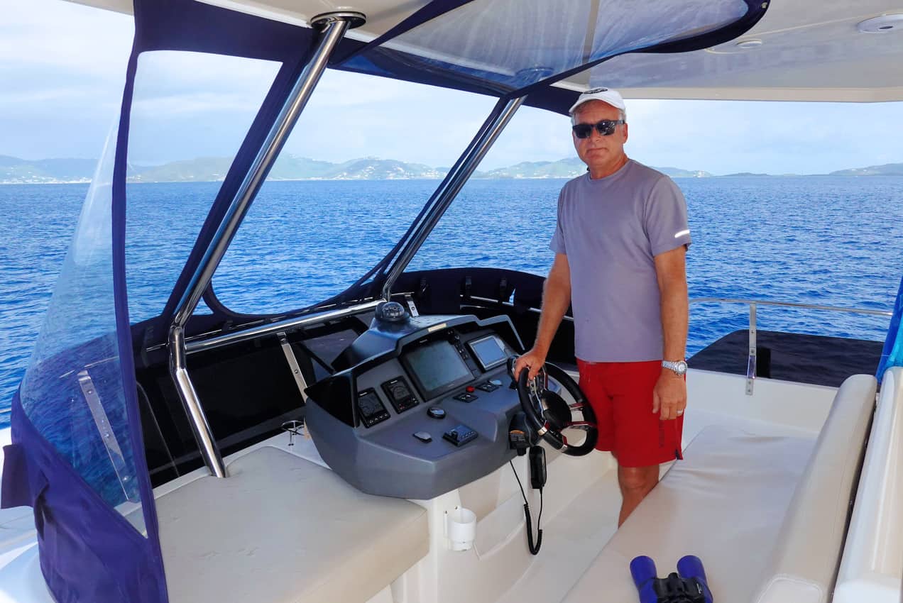 Captain Tab Hauser at the Helm in the British Virgin Islands.