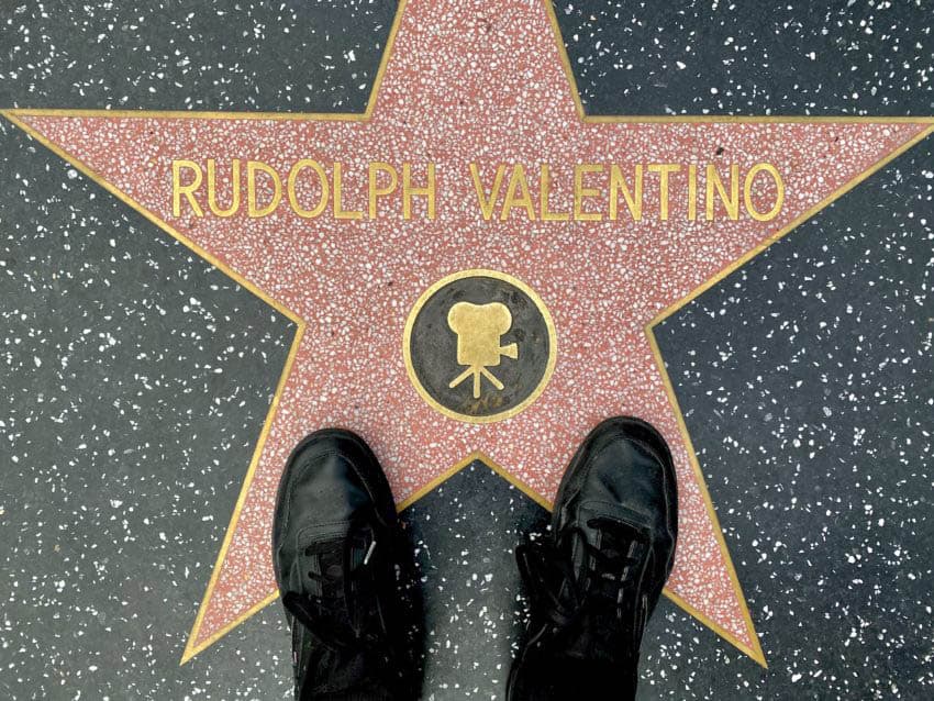 One of America’s earliest pop icons and a sex symbol of the roaring twenties, Rudolf Valentino Is memorialized in stellar fashion along with over 2,600 other terrazzo and brass stars lining the Hollywood Walk of Fame, trampled by selfie-obsessed hordes during healthier times.