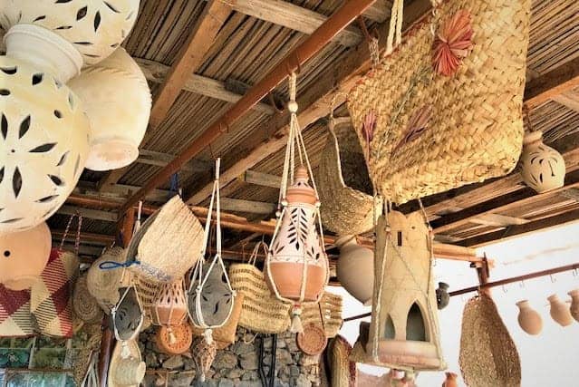 pottery and traditional wicker bags at the shop in Misfat Al Abriyeen, Oman.