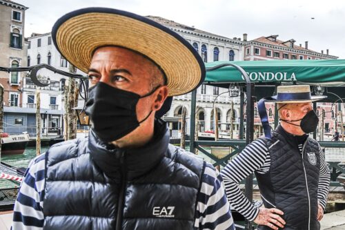 Gondoliers wait for customers in Venice.