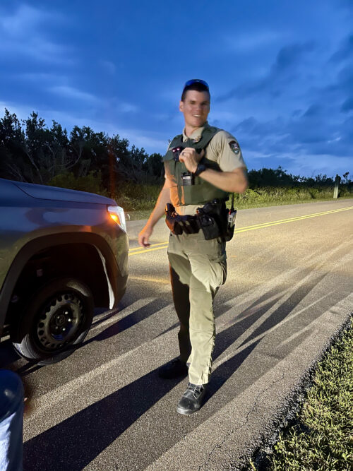 Merritt Island National Wildlife Rufuges’ Ranger Goss proved to be a good sport during our traffic stop, helping to change our flat tire
