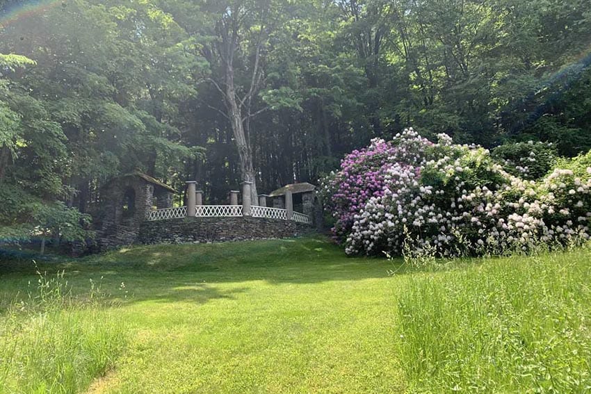 The rhododendron tunnel that leads to a stone walkway at the Vermont estate. Aysia Reed photos.