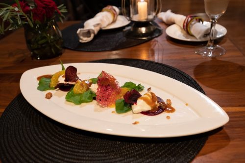 The beetroot, orange, and goat cheese salad with candied walnuts at The Bistro is artfully presented.