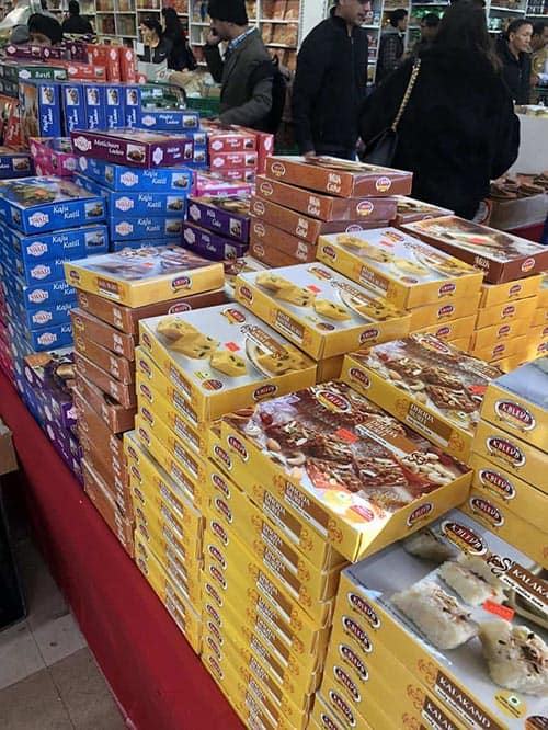 Boxes of traditional sweets are sold before Diwali festival in Jackson Heights, Queens. Photos by Susmita Sengupta