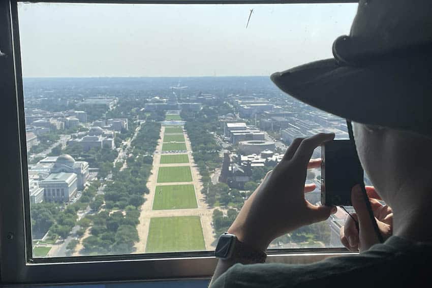 Capturing Instagram views of the U.S. Capitol from The Washington Monument. Photo by Nils Larson