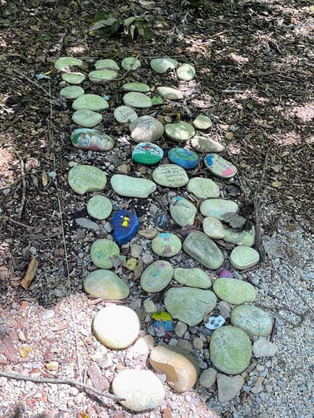 Painted rocks and twine outlines mark the slave graveyard at George Washington's Mount Vernon. Photo credit: Nils Larson