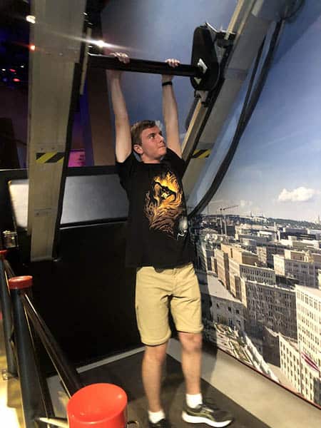 Dangling from a simulated construction crane at the International Spy Museum. Photo by Kirsten W. Larson