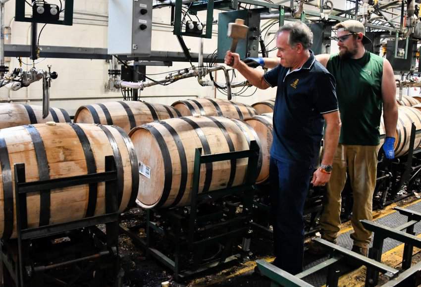 Tab Hauser sealing bourbon barrell at Buffalo Trace, Central Kentucky, Lexington