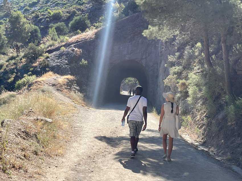 Hikers cross through many tunnels on the trek. 