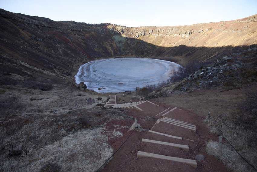 The Kerid Crater is known as a maar because of the pool of water, frozen in early April, at the center.