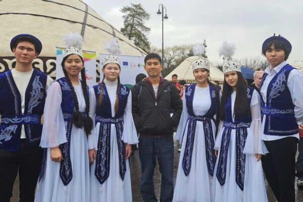 The writer, Teh Chin Liang, poses with a group of costumed Nowruz revelers