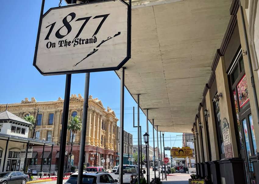 The Strand is the main street of historic Galveston and is lined with century old buildings now holding restaurants and trendy shops.