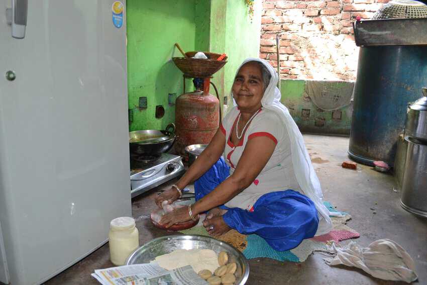 A woman cooking chapati at home