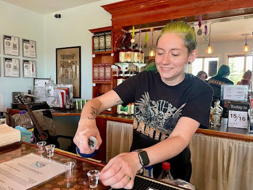 Kallie Hershberg, assistant distiller at Grand Teton Distillery, pours tastes of the award-winning vodka made from Idaho potatoes and water from the mountains and glaciers in the Tetons. Photo by Anne Braly