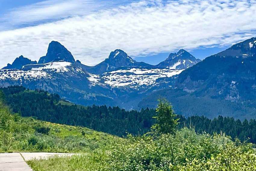 The Three Sisters of the Tetons rise above Teton Valley.