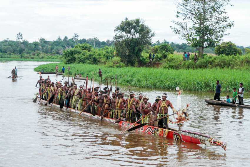 A Gogodala war canoe greets anglers in Western Province