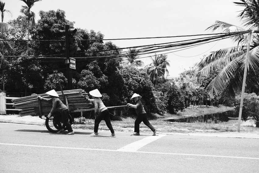 Three workers in Hoi An. Photo by Evan Glassman