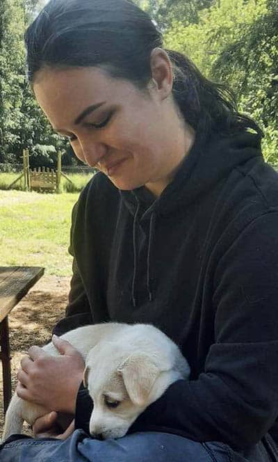 The author with a husky/lab cross puppy. Photo by David Palz