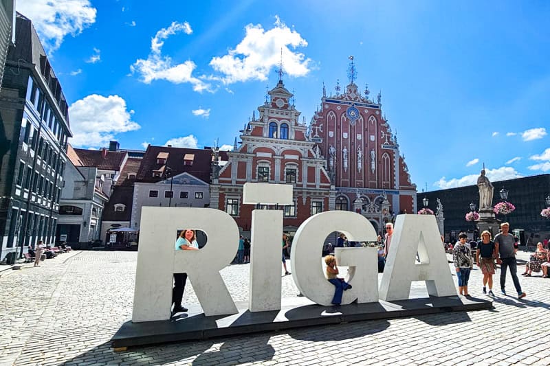 Riga sign with House of Blackheads in the background.