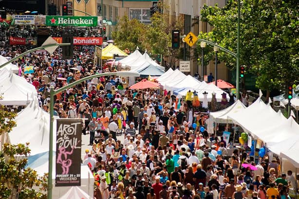 Festival-goers enjoying the Art & Soul Festival, a vibrant celebration of creativity and community in Oakland.