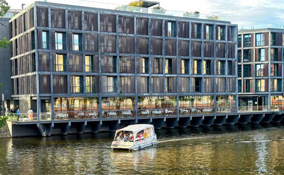 Wroclaw's riverfront buildings are a mix of modern and historic.