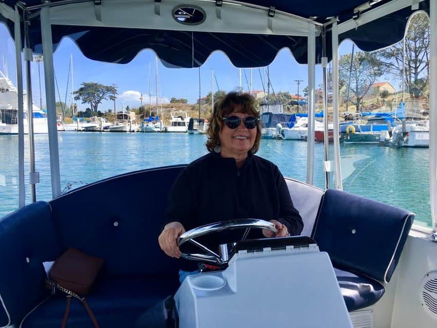 The author behind the helm of a Duffy boat in Balboa.